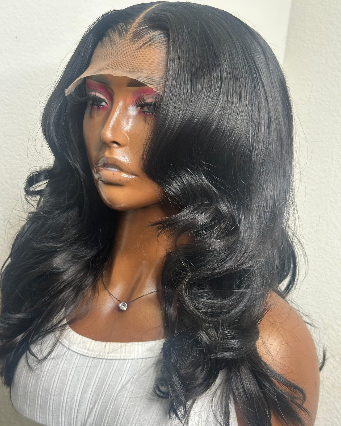 Barbie natural black body wave wig – left side angle with soft curls.