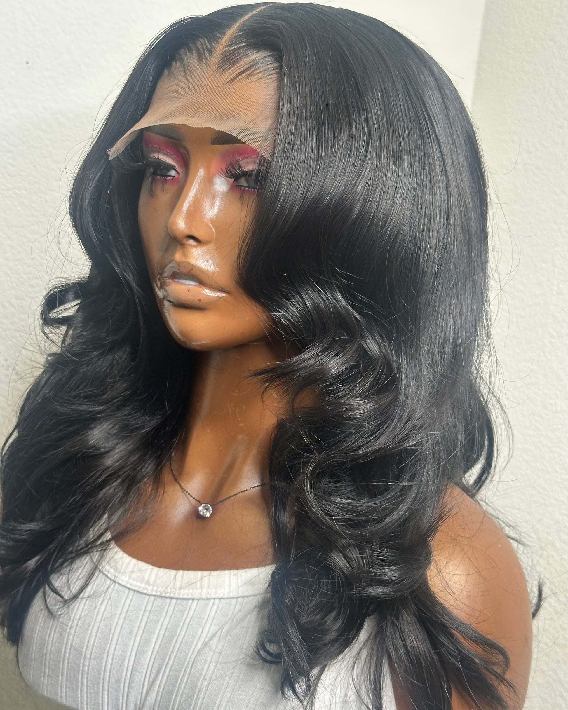 Barbie natural black body wave wig – left side angle with soft curls.